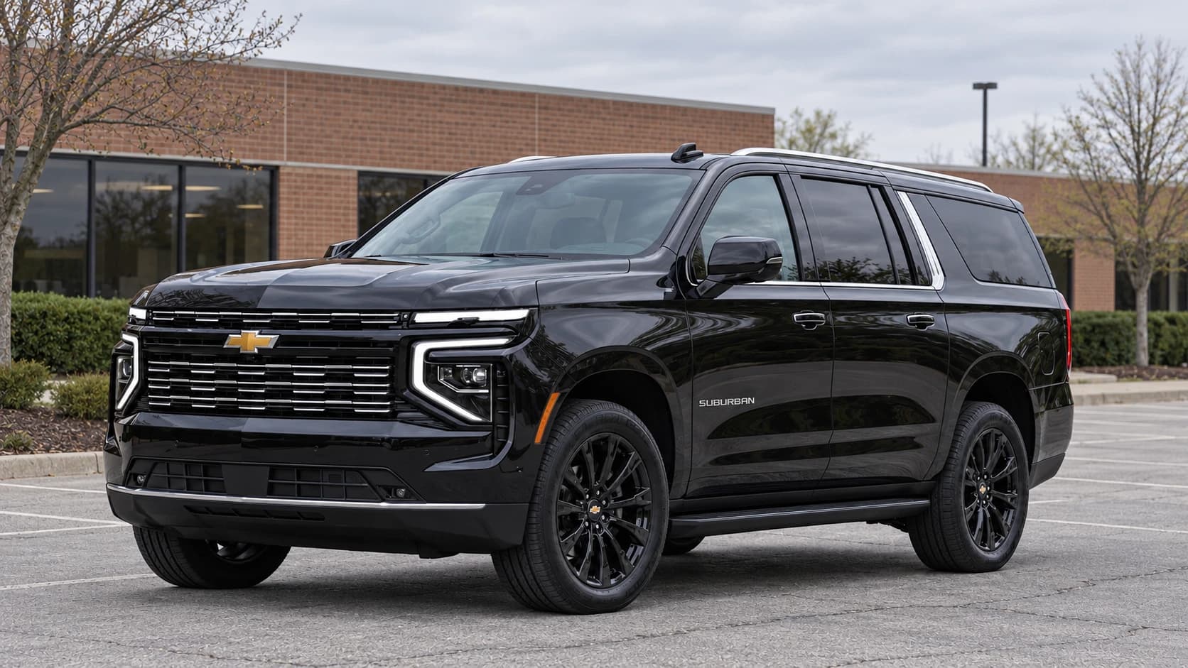 Black 2025 Chevrolet Suburban with black rims