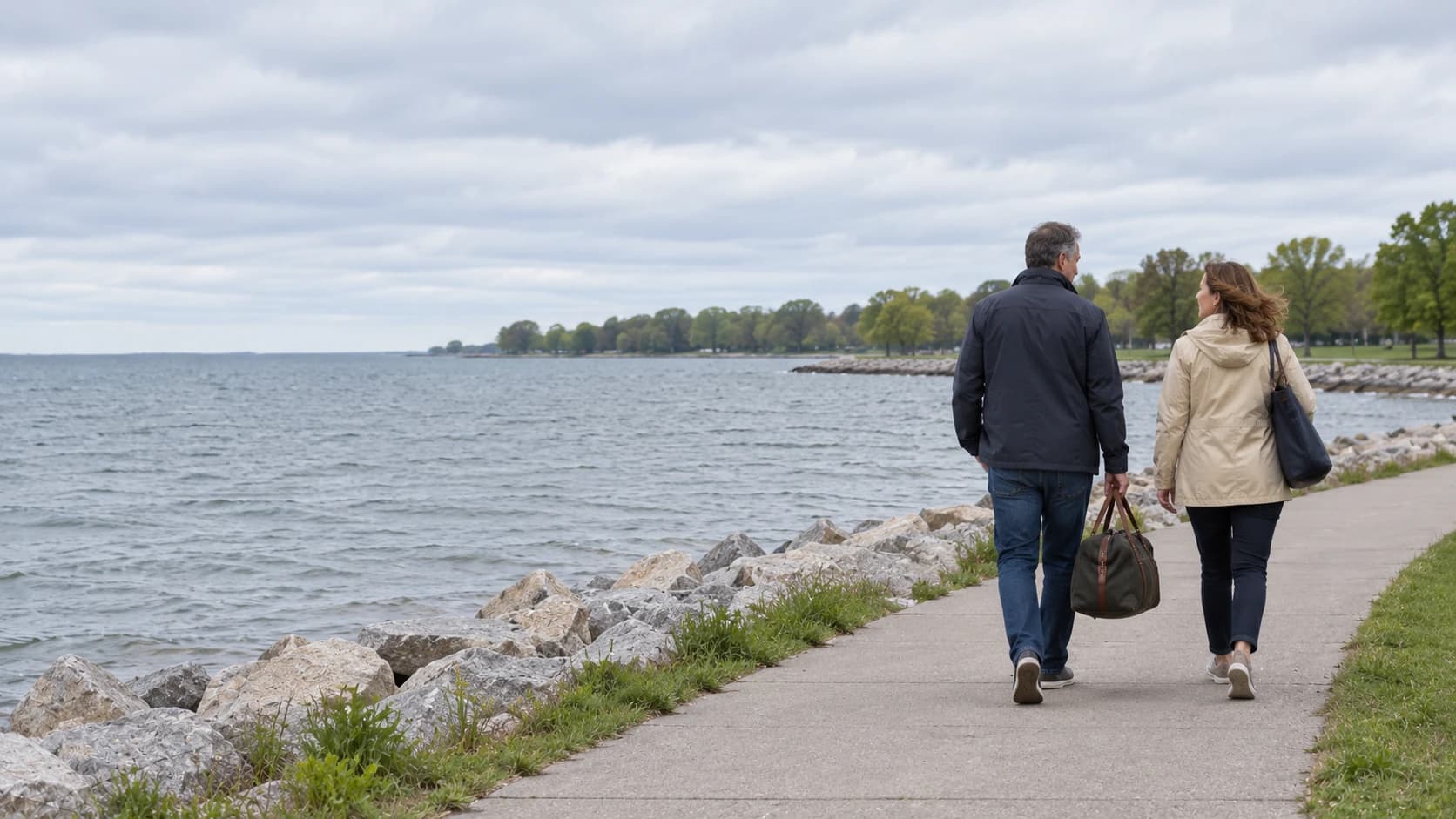 Travelers walking beside a quiet Midwestern waterfront